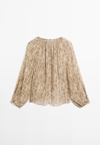 Durchsichtige, beigefarbene Bluse mit langen Ärmeln, die ein wellenförmiges schwarzes Muster und einen gerafften Ausschnitt aufweist. Leichter Stoff mit einer zarten Textur.