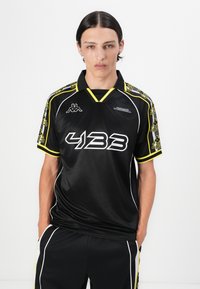 Black short-sleeve jersey with yellow accents. Features "433" logo in bold white, Kappa logo on the chest, and patterned trim on sleeves.