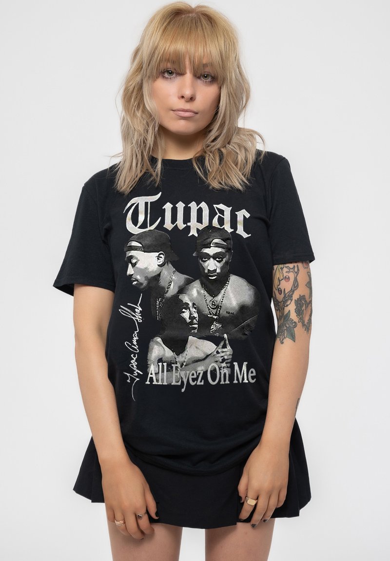 Black cotton t-shirt featuring a graphic print of two figures and the text "Tupac All Eyez On Me" in silver, with a crew neck and short sleeves.
