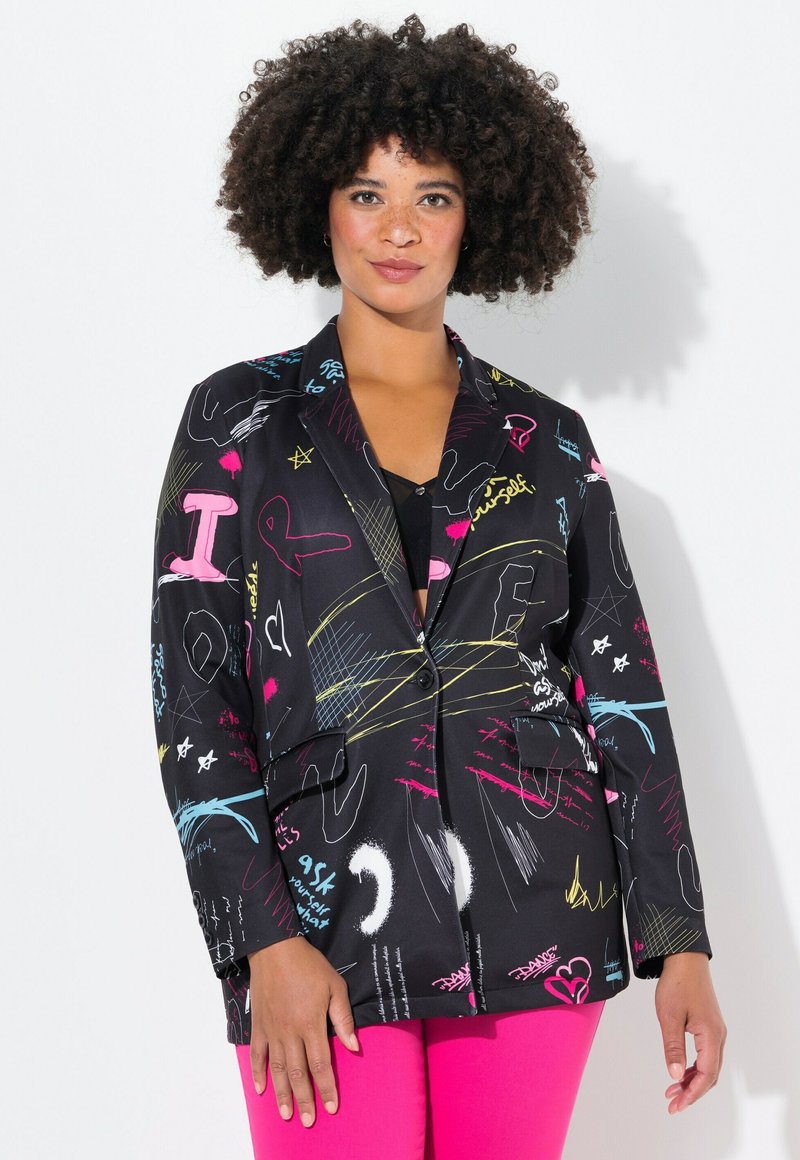 Blazer noir avec des motifs de style graffiti colorés en rose, bleu et jaune. Il présente une fermeture à un bouton et deux poches avant.