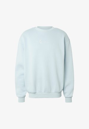 Jasnoniebieska bluza z długim rękawem i okrągłym dekoltem, z prążkowanymi mankietami i ściągaczem u dołu, z subtelnym białym haftem na środku klatki piersiowej.