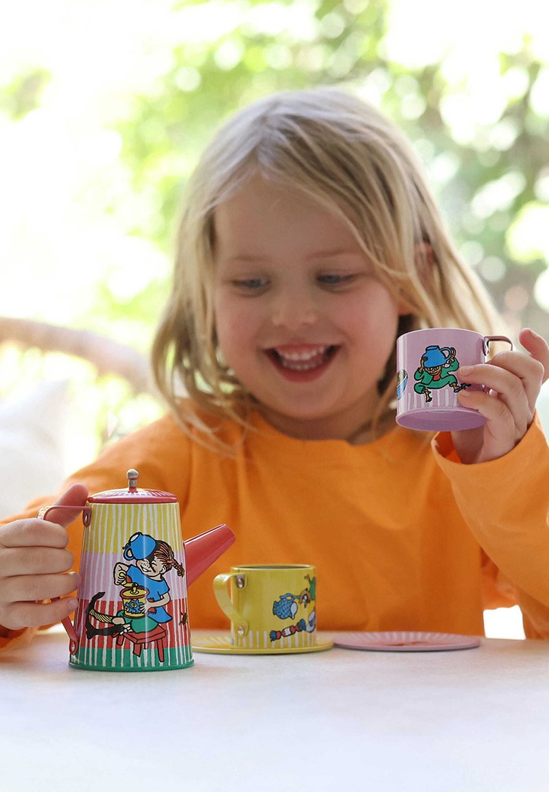 Colorful metal tea set features a pink-striped teapot and yellow cup with playful illustrations. Smooth texture and sturdy design enhance usability.