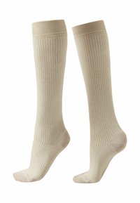 Beige Kniestrümpfe mit gerippter Textur und hellen, kontrastierenden Streifen. Weiches Material mit verstärkten Zehen- und Fersenbereichen.