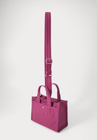 Purple fabric tote bag with dual handles and an adjustable strap. Features a front zipper and contrasting stitching along the sides.