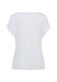 T-shirt blanc uni à manches courtes, coupe ample, col rond, vu de dos sur fond blanc.