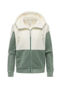 Felpa con cappuccio e zip realizzata in tessuto a coste, con una parte superiore color crema e una parte inferiore verde, dotata di coulisse regolabile e tasche laterali.