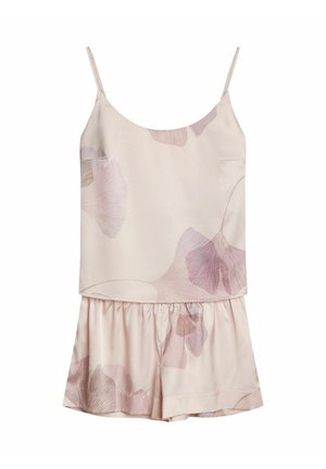 Bez rękawów kombinezon w jasnoróżowym materiale z kwiatowym wzorem w pastelowych odcieniach. Miękka tekstura, luźny krój i marszczona talia.