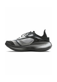 Black and gray athletic shoe featuring a mesh upper, rounded sole with dotted pattern, and a secure lace-up design.