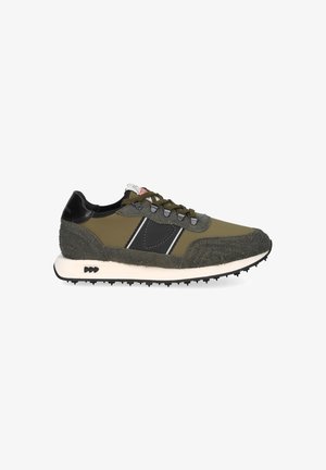 Olive green sneakers with black accents, featuring a textured suede upper, white midsole, and black rubber outsole with prominent studs.