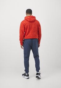 Nike Performance HERITAGE PANT - Tréningruha alsók - thunder blue