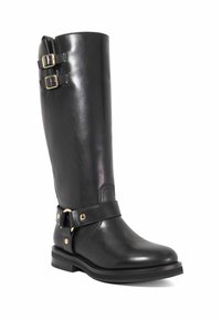 Black leather knee-high boot with dual gold buckle straps and a flat sole. Features a smooth texture and reinforced stitching at the ankle.