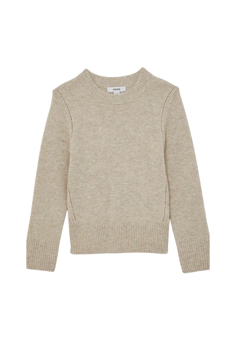 Maglione lavorato a maglia beige con polsini e orlo a coste, scollatura a girocollo e cuciture decorative lungo le cuciture laterali. Texture morbida.