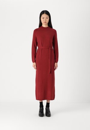 Maroon knit dress with a high neckline, long sleeves, and a tie belt at the waist. Features a straight silhouette and ribbed hem.