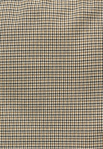 Motif textile pied-de-poule noir, blanc et fauve avec de petits carreaux complexes formant une texture de tissu tissé classique.