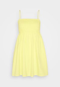 Smockklänning i ljusgul bomull, med en åtsittande bodice med smock och en flödande kjol, spaghettiband och en avslappnad silhuett.