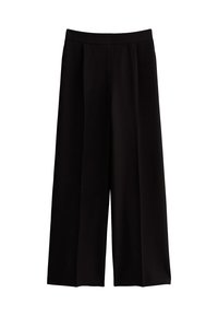 Pantalones de pierna ancha en negro, fabricados con una tela suave, que presentan una cinturilla elástica lisa y sin cierres ni estampados visibles.