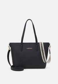 Black leather tote bag with two top handles and a detachable shoulder strap. Features gold logo and textured finish. Functional and sleek design.