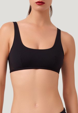Schwarzer Sport-BH mit quadratischem Ausschnitt, breiten Trägern und glattem Stoff. Besitzt minimale Nähte und ein figurbetontes Design für hohen Tragekomfort.