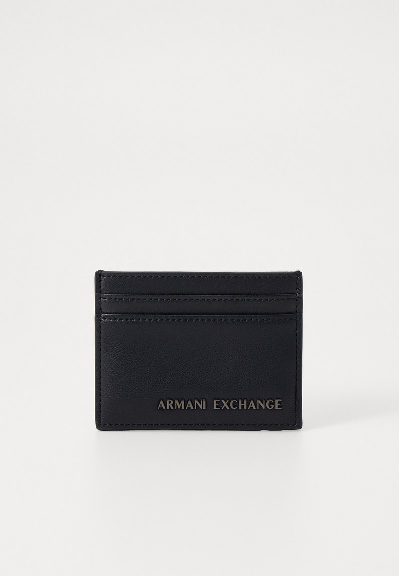 Black leather card holder featuring multiple card slots, embossed "ARMANI EXCHANGE" logo, sleek design, and smooth texture.