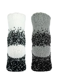 Strickbeine mit einer flauschigen Textur, die ein Farbverlaufsmuster in Weiß, Grau und Schwarz aufweisen. Weich und dehnbar, entworfen für Komfort.