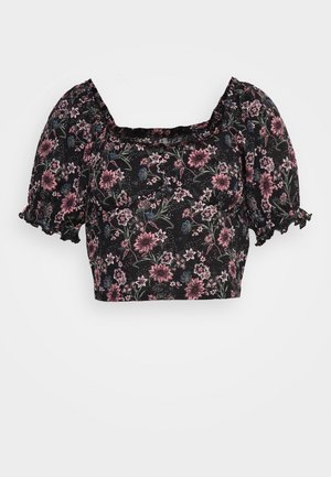 Black cropped blouse with floral pattern in pink, blue, and green, featuring puff sleeves and a square neckline with ruffled edges.