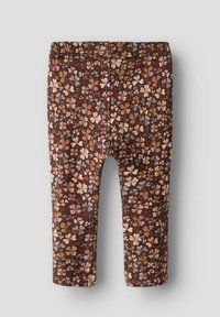 Leggings pour bébé marron avec un motif floral multicolore, taille élastique et jambes droites.