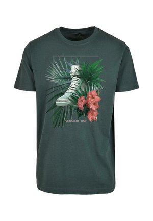 Dark green cotton t-shirt featuring a graphic design of a white sneaker surrounded by tropical leaves and pink flowers. Text reads "SUMMAIR TIME."