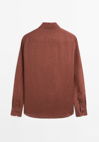 Long-sleeve shirt in a warm brown hue, featuring a collared neck, button cuffs, and a textured fabric with a subtle pattern.