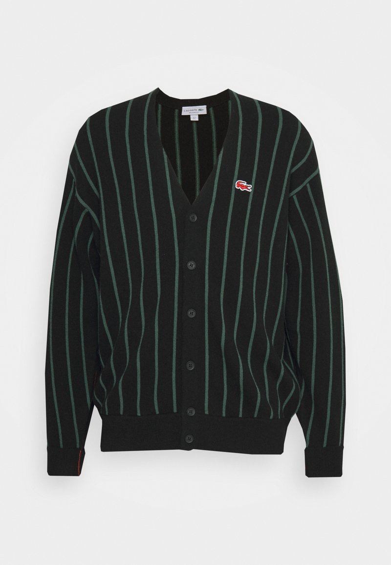 Black cardigan with vertical green stripes, V-neck, seven buttons down the front, and a small red logo on the chest. Soft knit material.