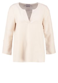 Blouse à manches longues de couleur crème avec un décolleté en forme d'entaille en V et un ourlet droit, conçue pour une coupe décontractée.