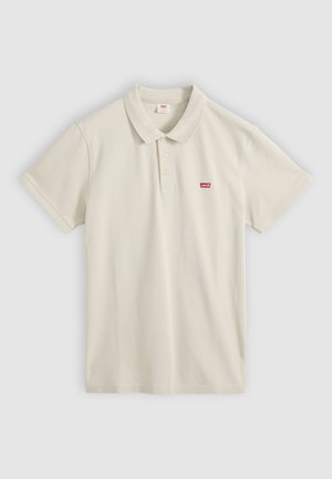 Beež lühikeste varrukatega polosärk krae ja kolme nupuga, vasakul rinnal väike punane Levi's logo.