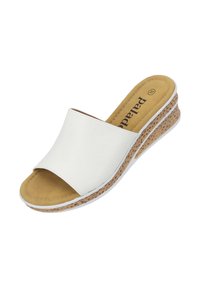 Sandal in pelle bianca con apertura sulla punta, caratterizzato da una suola in sughero testurizzato e una soletta imbottita color marrone.