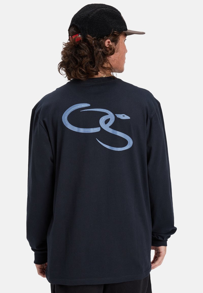 Navy long-sleeve t-shirt featuring a light blue snake graphic on the back. Made of cotton with a relaxed fit and round neckline.