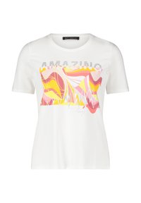 White short-sleeve t-shirt featuring a colorful abstract graphic design in pink, yellow, and red with "AMAZING" text embellished in rhinestones.