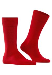 Calcetines de algodón rojo con una textura suave, de longitud estándar y refuerzo en el talón y en los dedos. Sin patrones ni detalles adicionales.