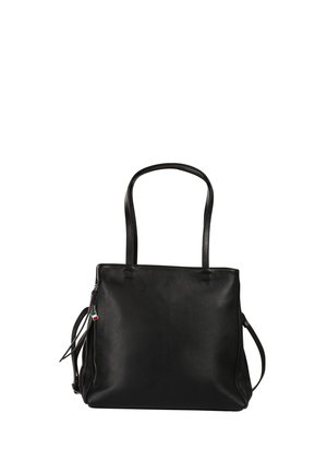 Black leather tote bag with long handles, side zipper pocket, and small red, white, and green tag on zipper pull.