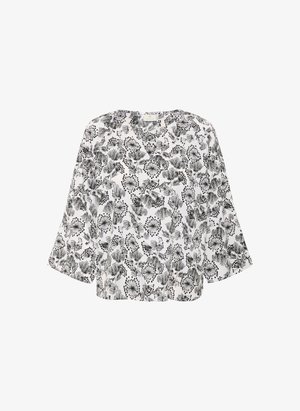 Vit blus med svarta blommor och bladmönster, rund halsringning och ärmar i armbågs-längd. Lättviktig tyg med lös passform.