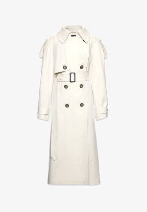 Pikk kreemjas trench-coat laia kraega, kahe nööbiga esiosa, musta pandlaga vöö ning mansetirihmad.