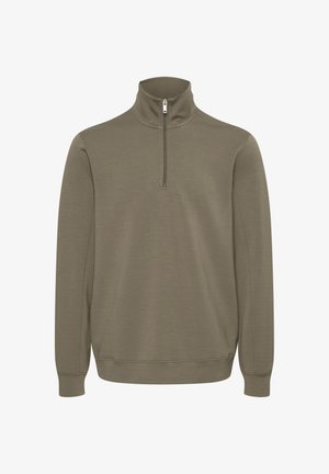 Olivno zelen pulover z delnim zadrgo na vratu, dolgimi rokavi ter rebrastim robom in manšetami. Mehak material z gladko teksturo.