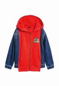 Red hoodie with denim sleeves, featuring a front zipper and kangaroo pockets. Embroidered graphic on chest, soft texture, casual design.