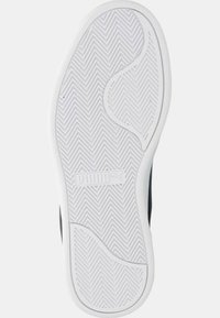 Suola di scarpe in gomma bianca con un motivo a chevron, caratterizzata da una superficie testurizzata e un logo prominente al centro.