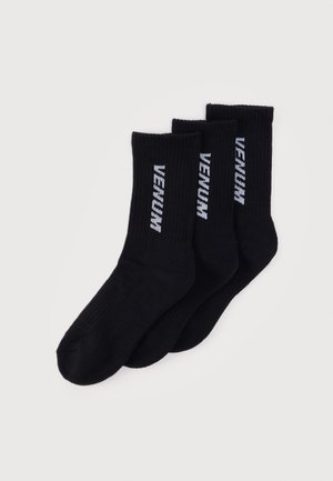 Black cotton athletic socks, three-pack, ribbed texture, featuring white "VENUM" logo printed vertically on each sock.
