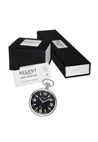 Montre de poche en argent avec un cadran noir, des marqueurs d'heure lumineux verts, des accents dorés et un matériel décoratif, accompagnée d'une boîte noire et d'une carte de garantie.