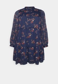 Vestido floral en tonos navy, fabricado en tejido ligero, con mangas largas, cierre frontal con botones y pliegues en capas que presentan pequeños y coloridos patrones florales.