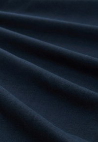 Dark navy fabric with a smooth texture, gently draped to show subtle folds and a uniform appearance, ideal for upholstery or clothing.