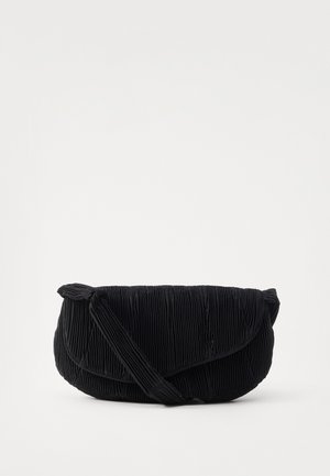 Black pleated tote bag with a rounded shape, fabric material, and a knotted accent on the strap. Features a soft texture and minimalist design.