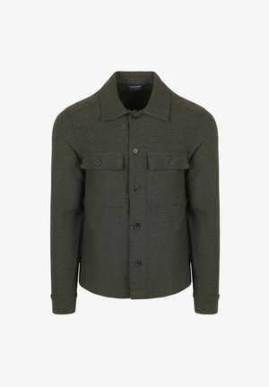 Groene, lange mouwen shirtjack gemaakt van een gestructureerde stof. Beschikt over twee borstzakken, knopen sluiting en een klassieke kraag.