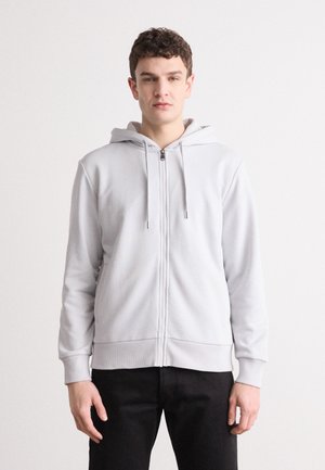 Light gray zip-up hoodie with a drawstring hood, made of soft material, featuring ribbed cuffs and hem, and a simple front design.