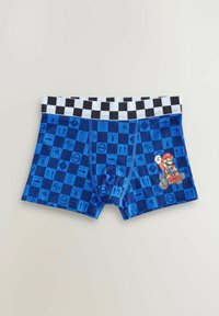 Blå boxershorts med et ternet bælte. Mønsteret er prydet med spilikoner i forskellige nuancer af blå. Indeholder en Mario-grafik på siden.