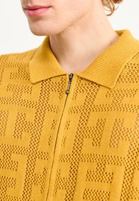 HUF MONOGRAM ZIP UNISEX - Vesta na kopčanje - dijon